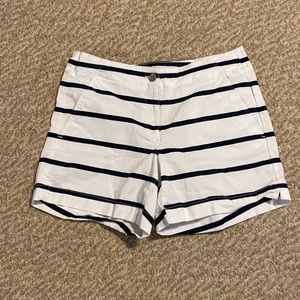 Nautica white shorts with blue stripes and sailboat logo